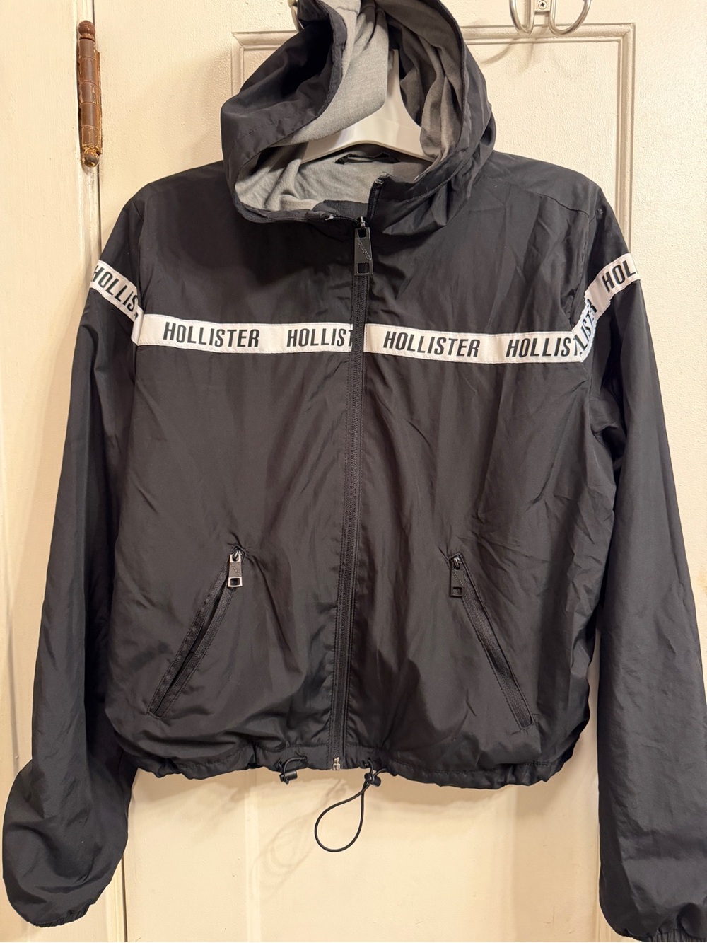 Hollister Black Hooded Windbreaker with White Logo Tape